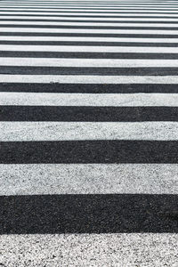 Full frame shot of zebra crossing on road