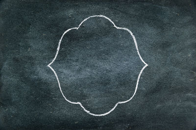 Directly above shot of heart shape drawn on wall