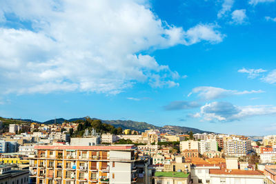 Buildings in city against sky