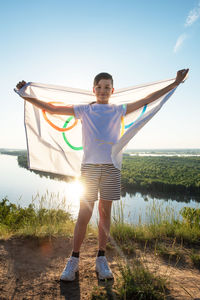 Full length portrait of man standing on land