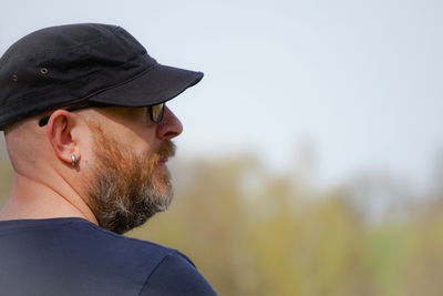 Close-up of man wearing cap