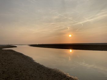 Scenic view of sea against sky during sunset