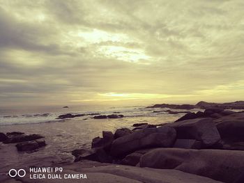 Scenic view of sea against sky at sunset