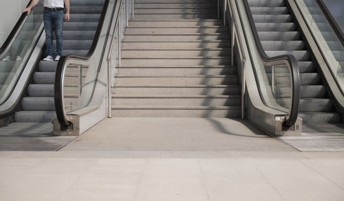 Low section of people on escalator of a public station in madrid