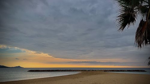 Scenic view of sea against sky at sunset