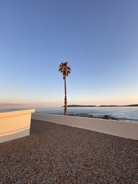 Scenic view of beach against clear sky