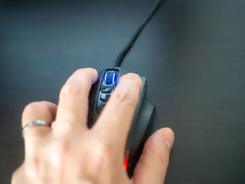 Close-up of hand holding mobile phone