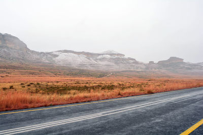 Country road leading towards mountains