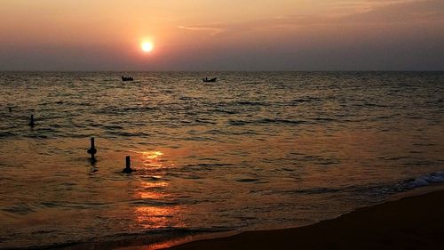 Scenic view of sea at sunset