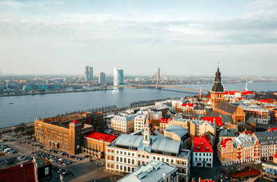 Panoramic view of old town with bright colorful houses and riga dome cathedral, bridge over