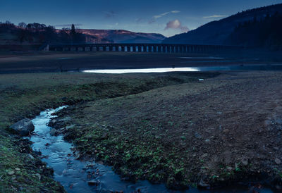 Bridge over river against sky