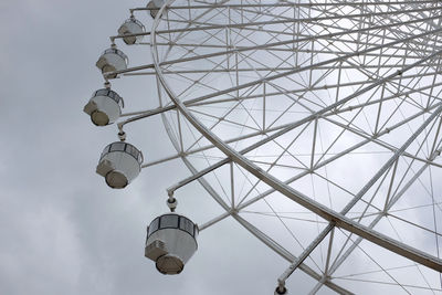 Low angle view of amusement park ride against sky