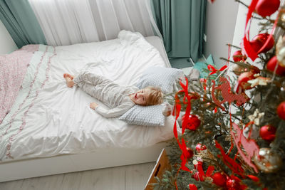 High angle view of christmas tree on bed at home