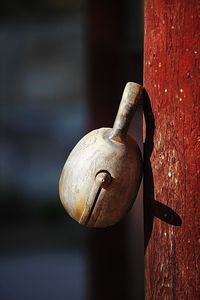 Close-up of padlock hanging on door