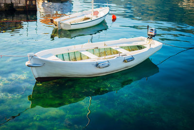 Boats moored in lake