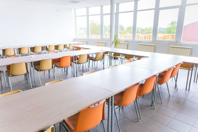 High angle view of empty chairs and table