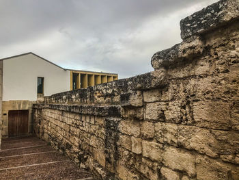 Old building against cloudy sky