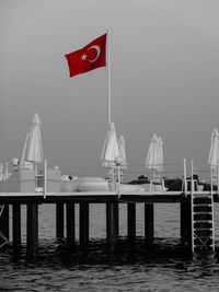 Pier over sea against sky
