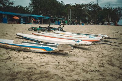 Boats moored on shore at beach