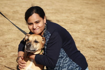 Woman holding dog