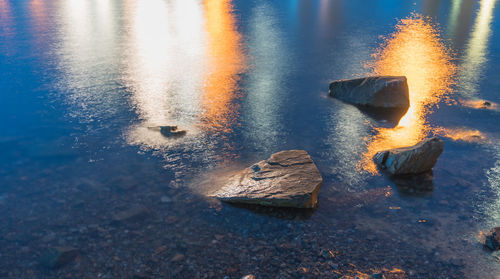 Reflection of rocks in water during winter