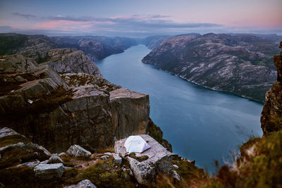 Scenic view of river amidst mountains against sky