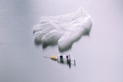 High angle view of colored pencils on white background