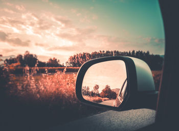 Reflection of car on side-view mirror