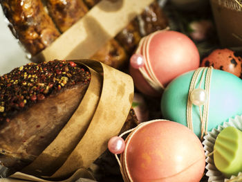 High angle view of food and easter eggs in basket