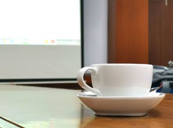 Close-up of coffee cup on table