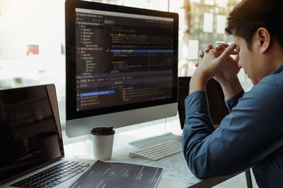 Man using laptop on table