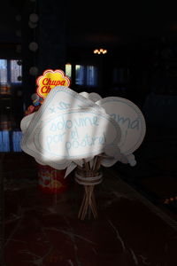 Illuminated candles on display at store