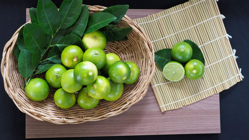 High angle view of apples in basket on table