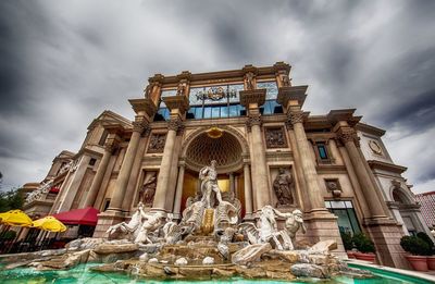 Low angle view of statue against cloudy sky