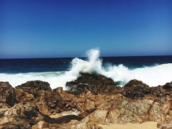 Scenic view of rock formation in sea