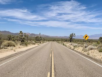 Empty road against sky