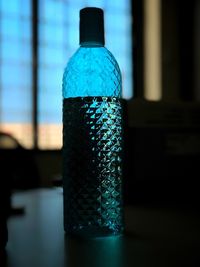 Close-up of water bottle on table