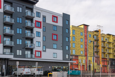Low angle view of multi colored buildings against sky