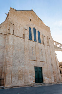 Low angle view of old building against sky