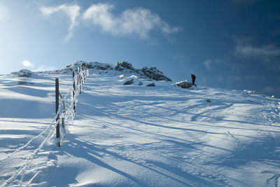 Scenic view of snow covered mountain against sky