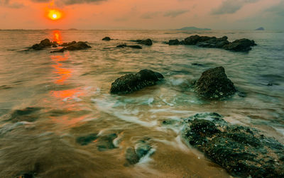 Scenic view of sea against sky during sunset