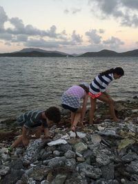 Children playing on sand at beach