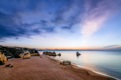 Scenic view of sea against cloudy sky