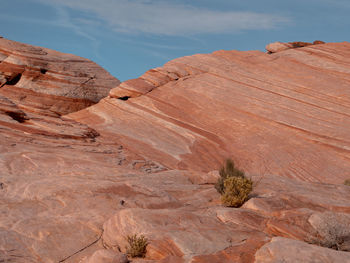 Rock formations in desert against sky