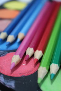 Close-up of colored pencils on table