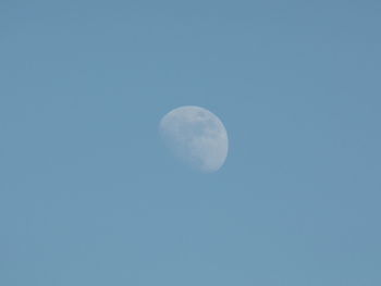 Low angle view of moon against clear sky