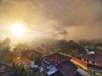 High angle view of houses and buildings against sky