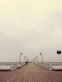 People on beach against sky