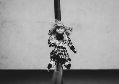 Close-up of doll on railing