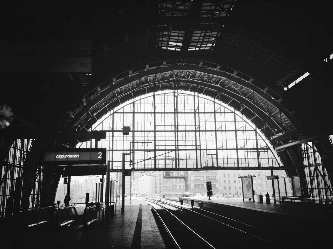 indoors, architecture, transportation, built structure, ceiling, arch, railroad station, the way forward, public transportation, rail transportation, railroad station platform, tunnel, interior, railroad track, mode of transport, diminishing perspective, railing, incidental people, empty, travel